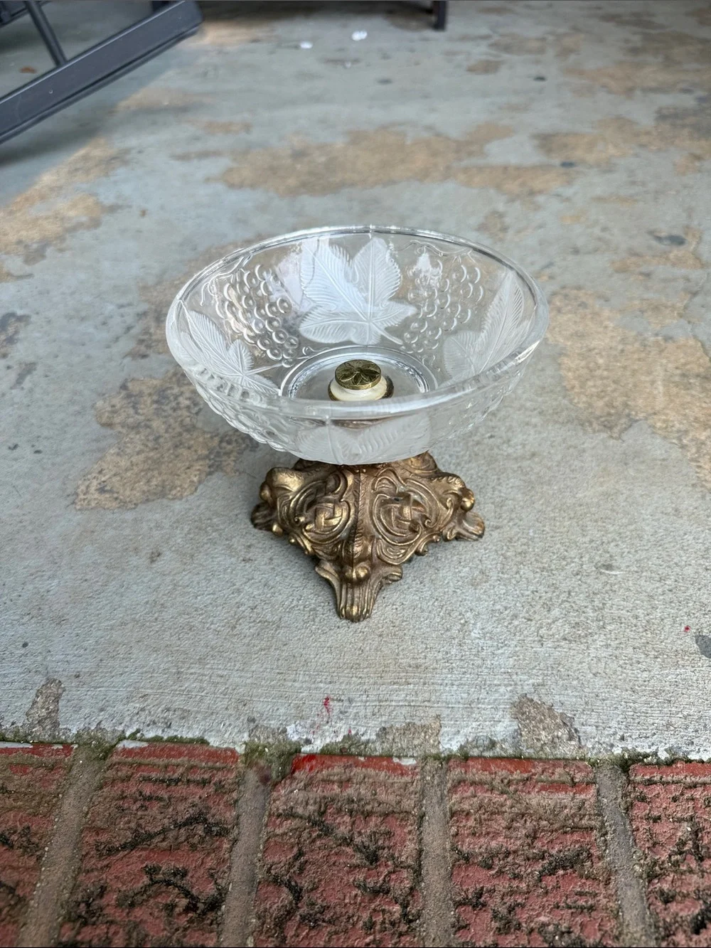Vintage Hollywood Regency glass bowl on brass frame